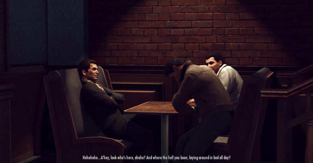 Трое мужчин сидят за столом в кафе