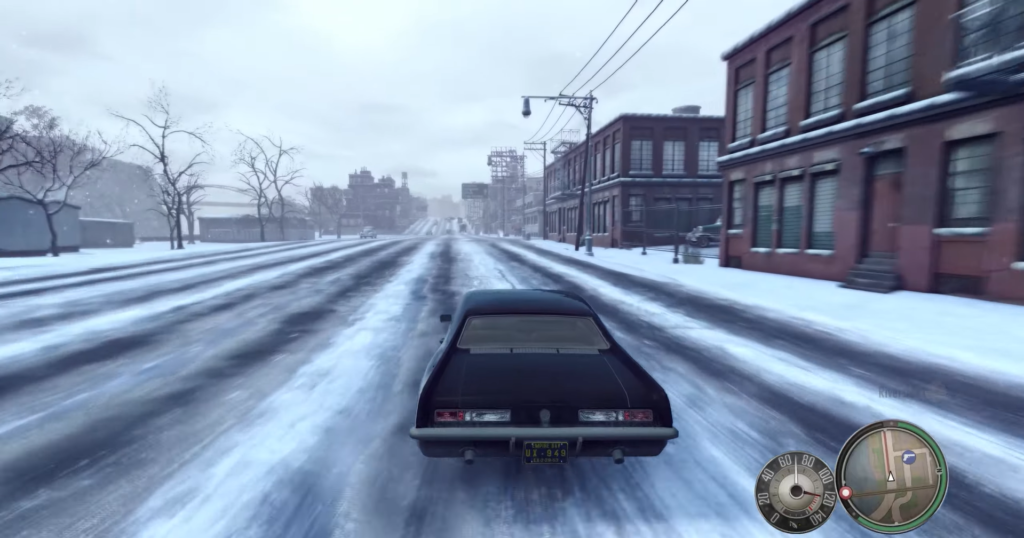 Машина едет по заснеженной улице в Mafia II