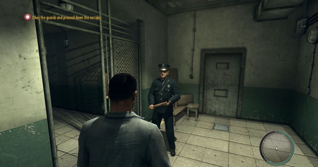 Охранник держит дубинку в тюремном коридоре Mafia II