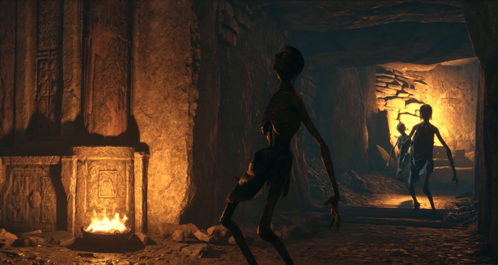 Три зомби идут по каменному подземелью при огне