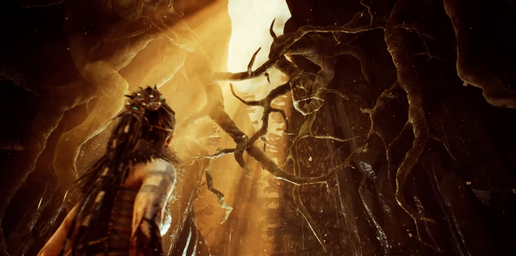 Сенуа из Hellblade смотрит на корни в пещере