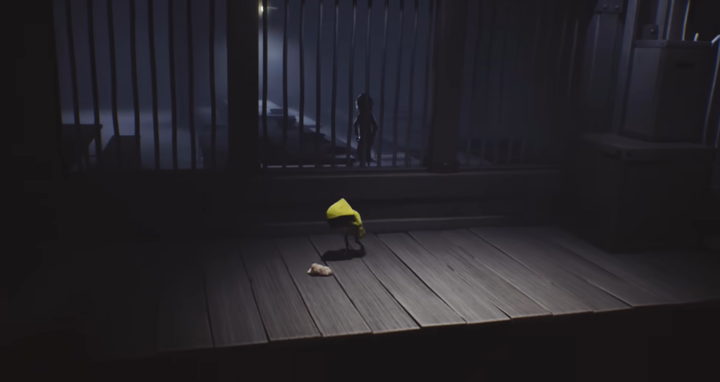 Шестая из Little Nightmares стоит в клетке