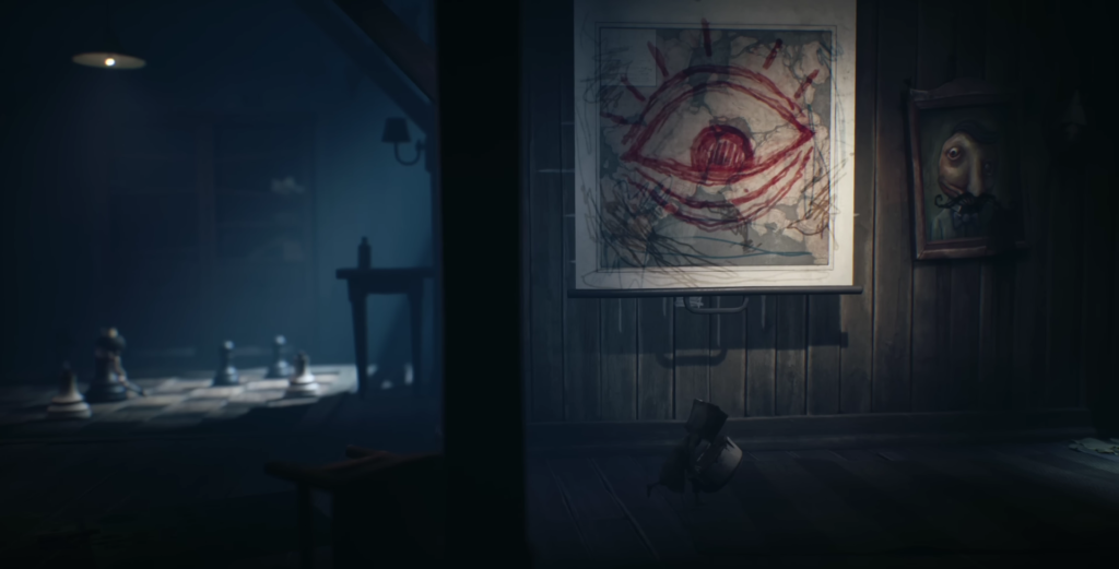 Рисунок красного глаза на мольберте в комнате