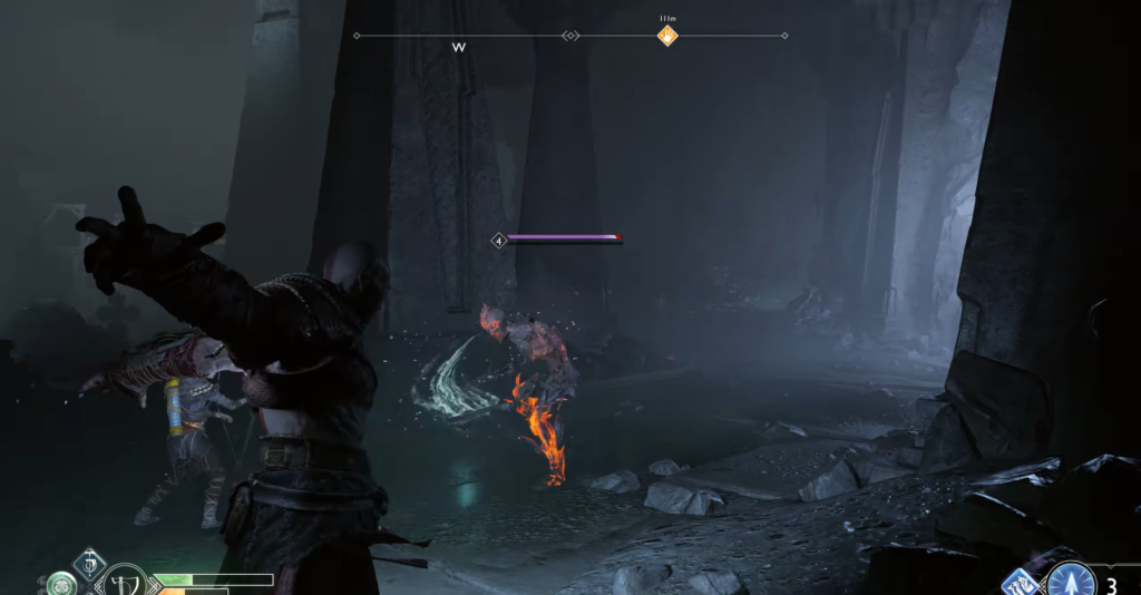 Кратос сражается с огненным врагом в пещере God of War