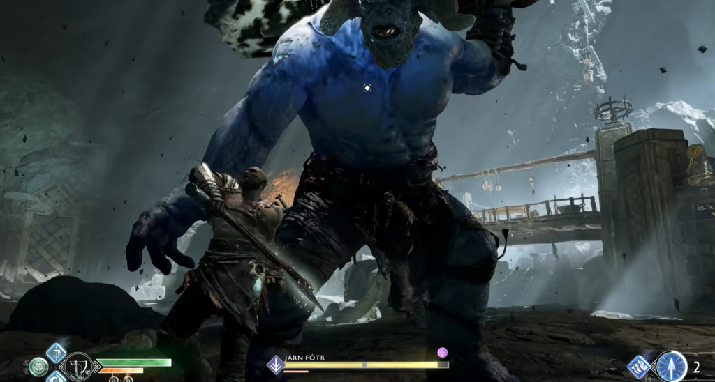 Кратос сражается с синим великаном в God of War