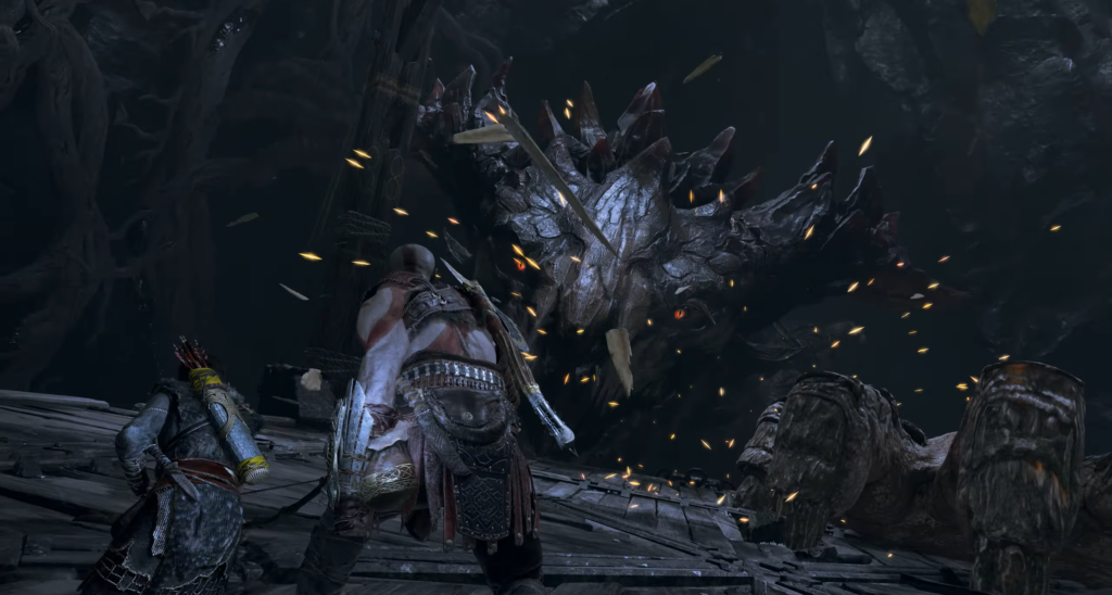 Кратос и Атрей сражаются с драконом в пещере