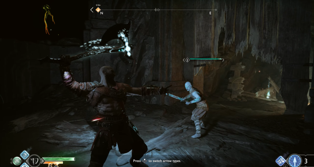 Кратос сражается с синим врагом в пещере