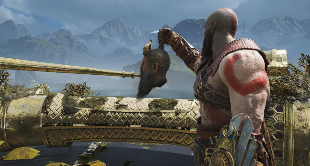 Кратос держит голову Мимира на мосту God of War