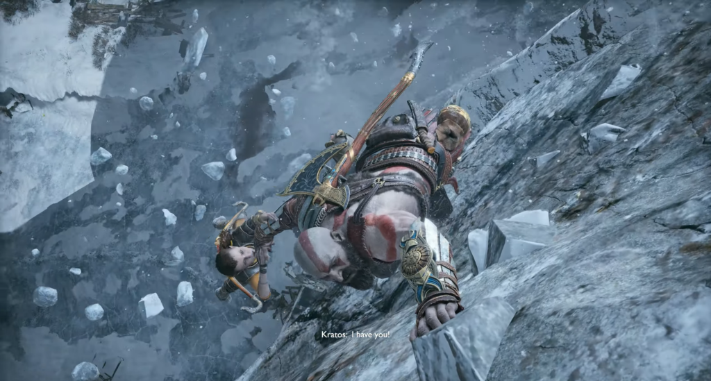 Кратос держит Атрея на снежной скале God of War